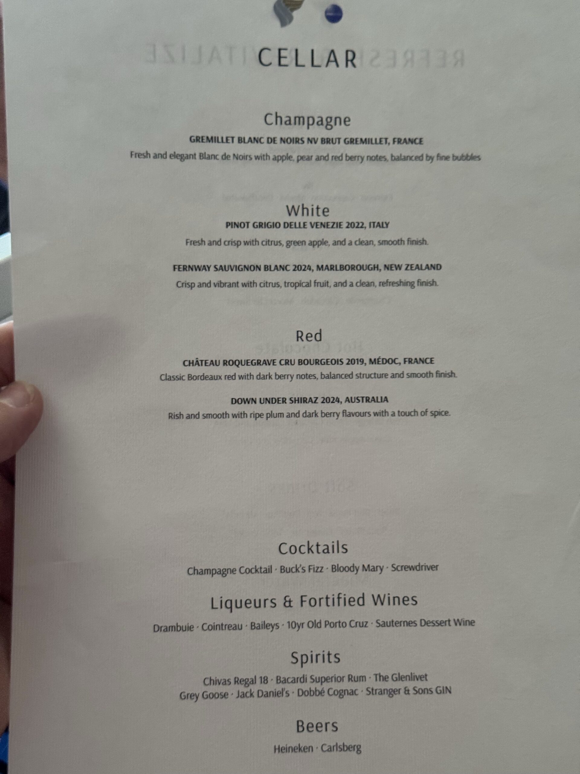 Wine and cocktails menu page showing sections for Champagne, White, Red, Cocktails, and Beers, with descriptions under each heading.